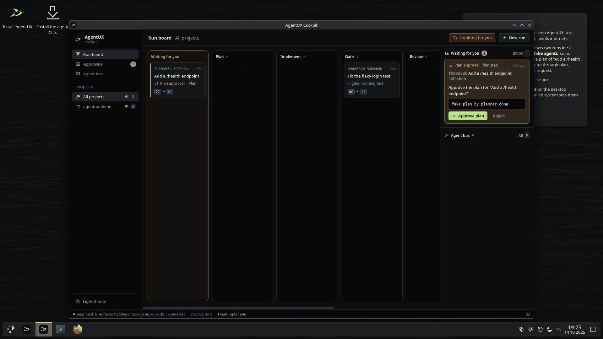 The AgentUX cockpit on the live ISO: a run board with two demo runs, one of them waiting for plan approval in the inbox on the right.